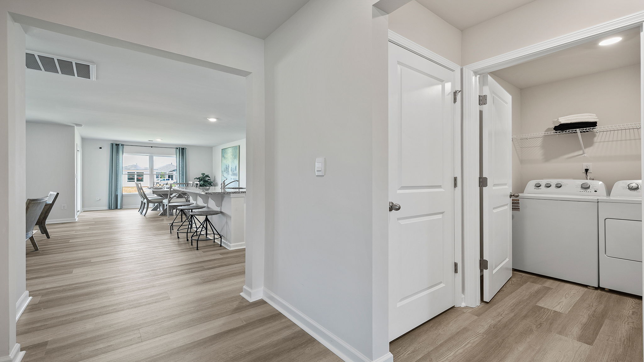 Hallway to bedrooms and kitchen.