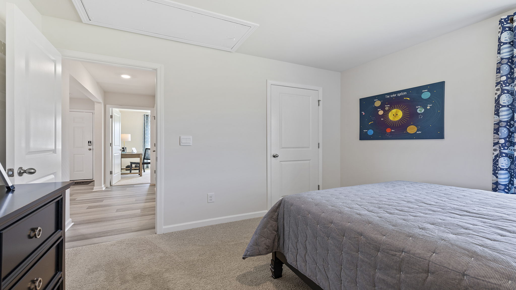 Bedroom with carpet and windows.