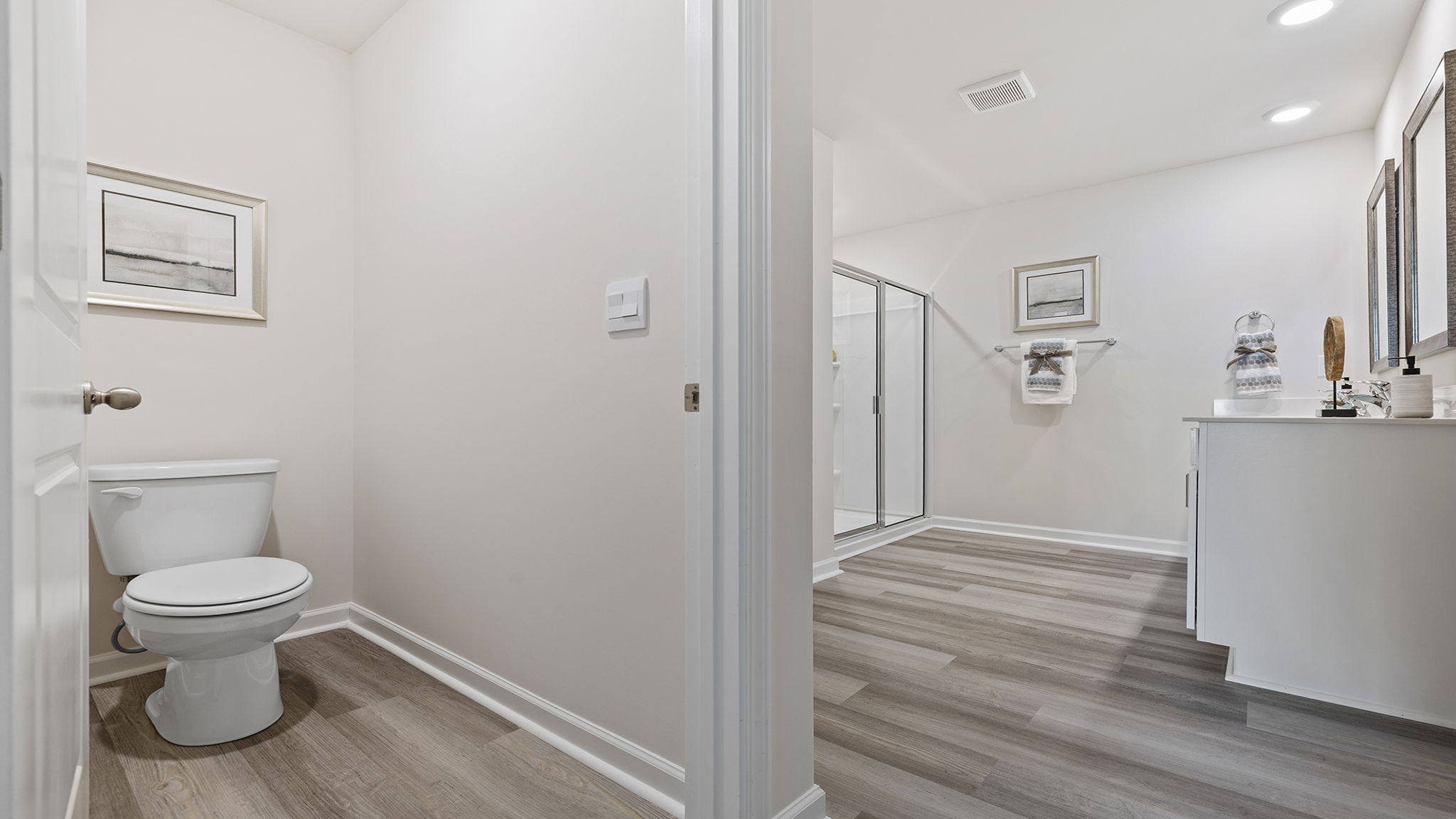 Hallway to primary bathroom.