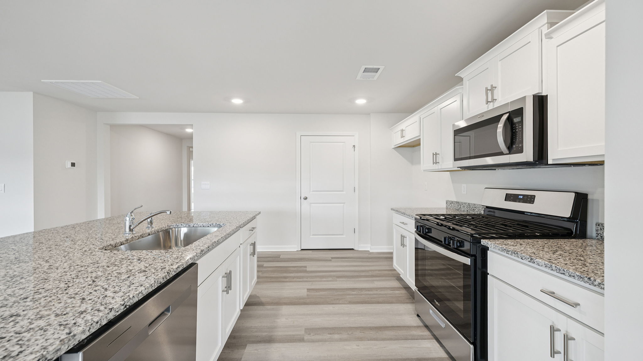 Island hosts the sink and dishwasher.