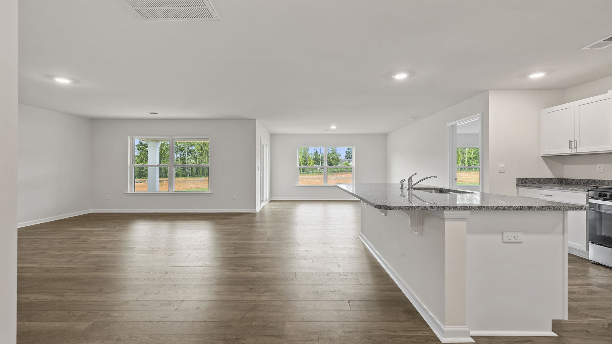 Kitchen open to the combination family and dining areas.