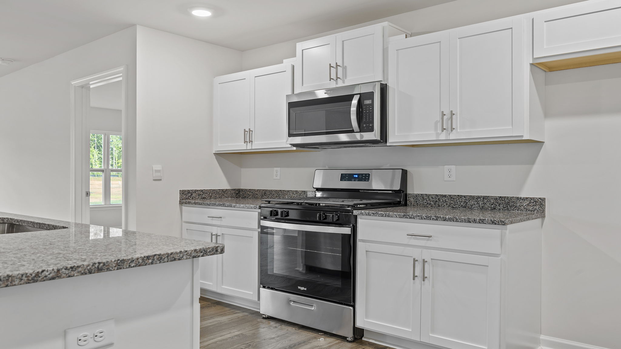 Kitchen features stainless steel appliances.