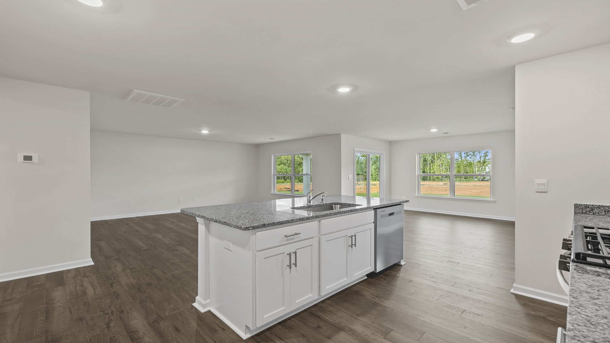 View from kitchen of  dining and family rooms.