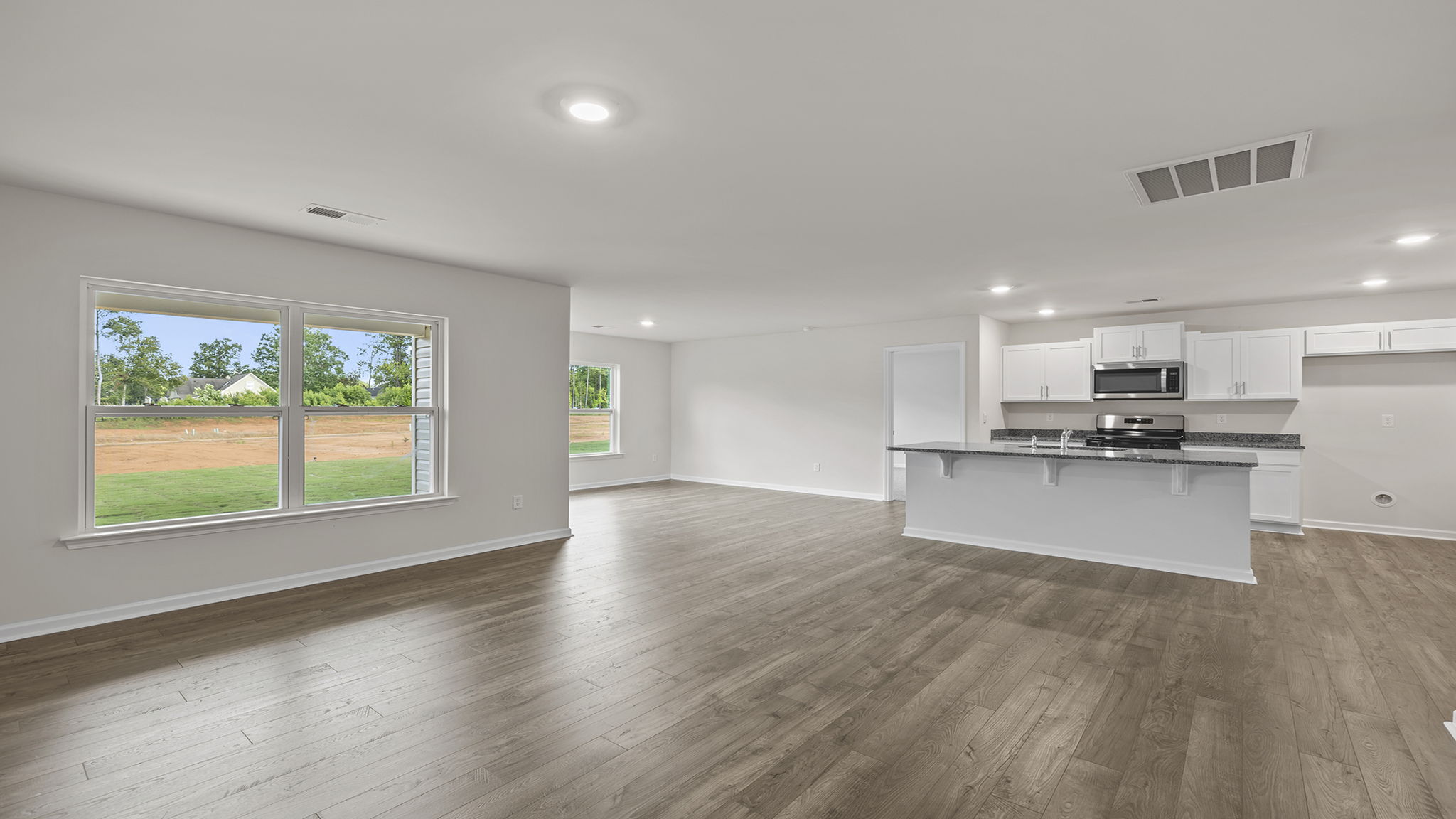View from family room with large window toward the kitchen.