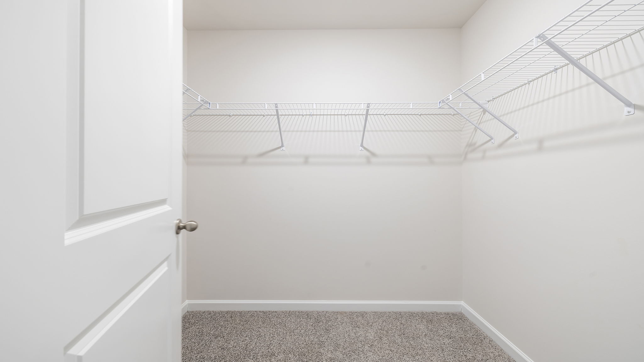 Primary bedroom walk in closet.
