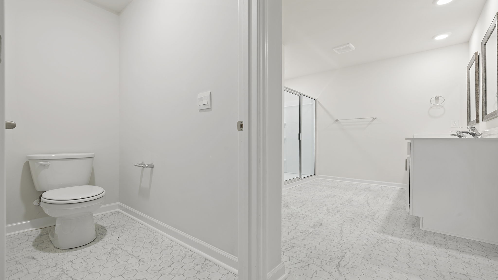 View of toilet area and the bathroom.