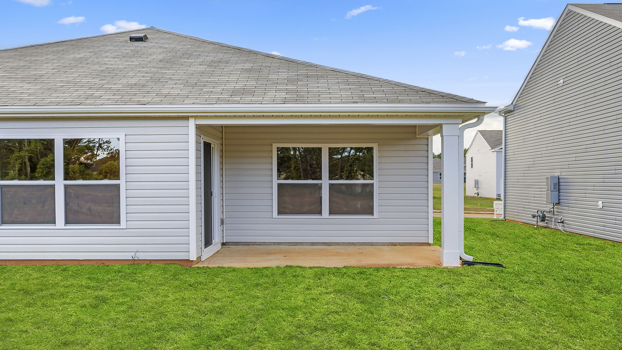 Back exterior view of the Aria with covered porch.