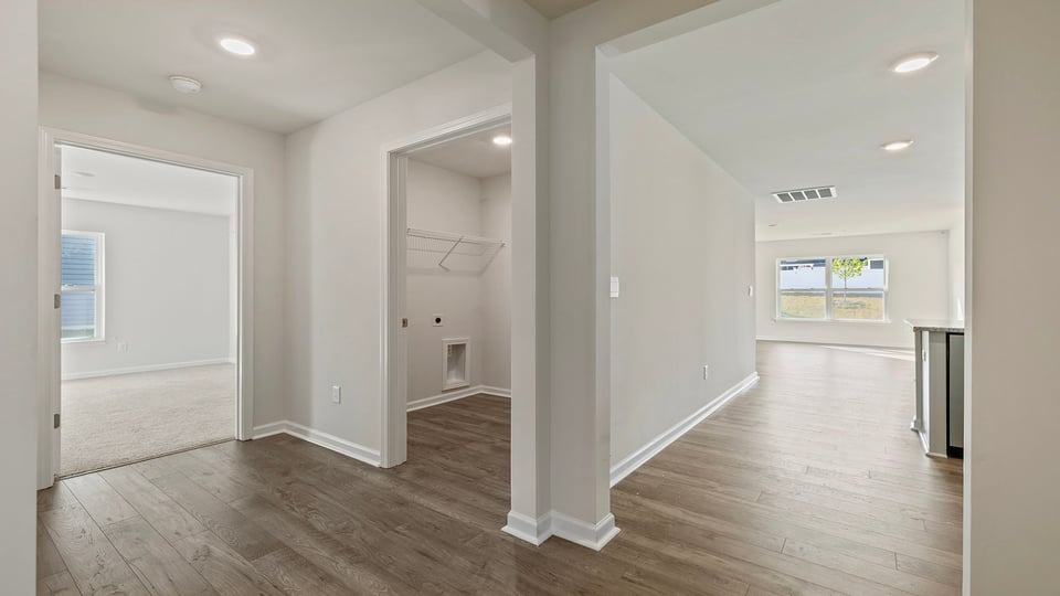View of hallway toward the living area and laundry room.