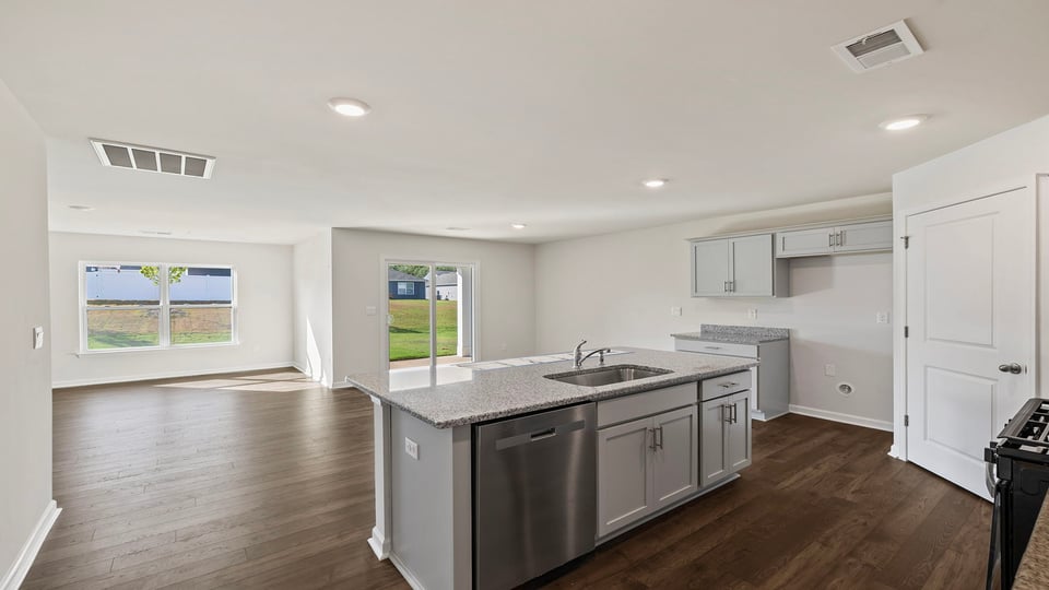 View of open floor plan with lots of windows.