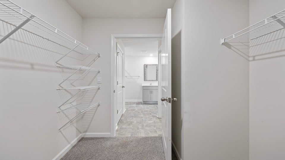 Primary bedroom walk-in closet.