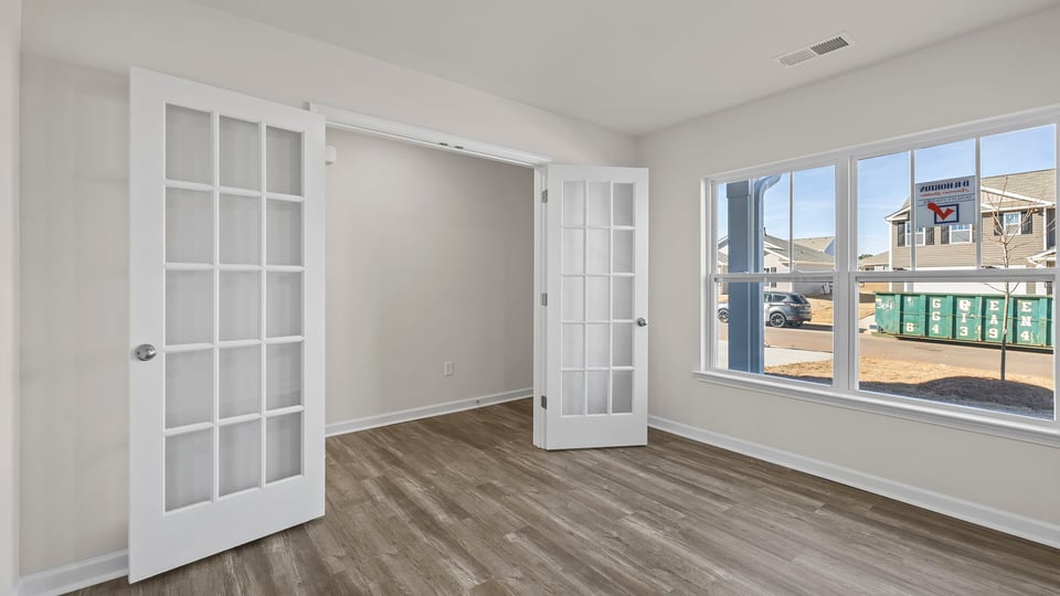 Study accented by French doors.