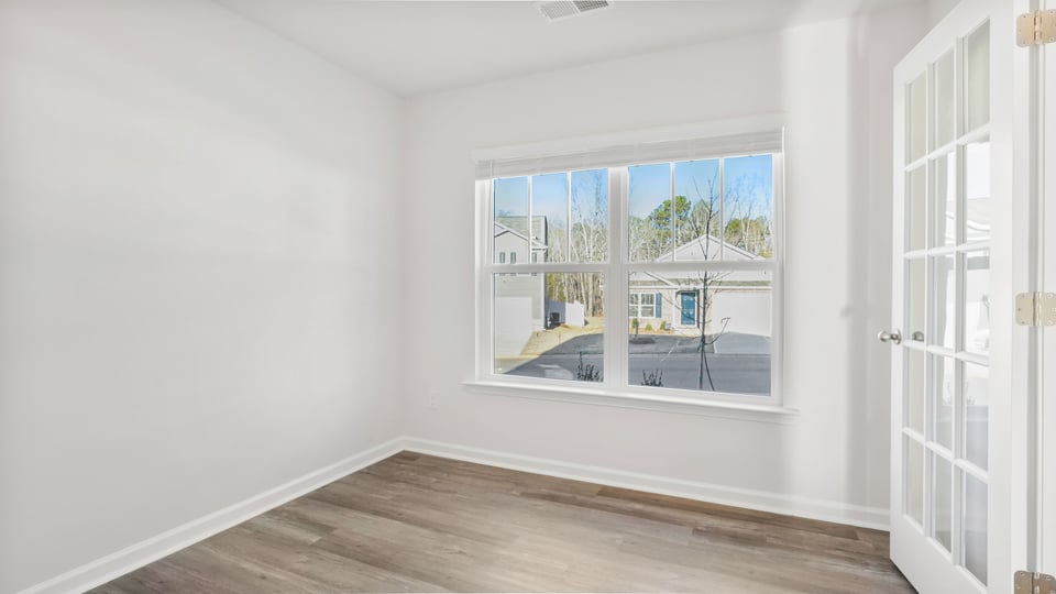 Study at the front of the home with large window.