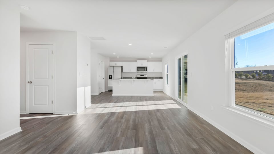 View of combination living and dining areas.