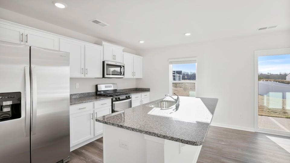 View of kitchen and dining area.