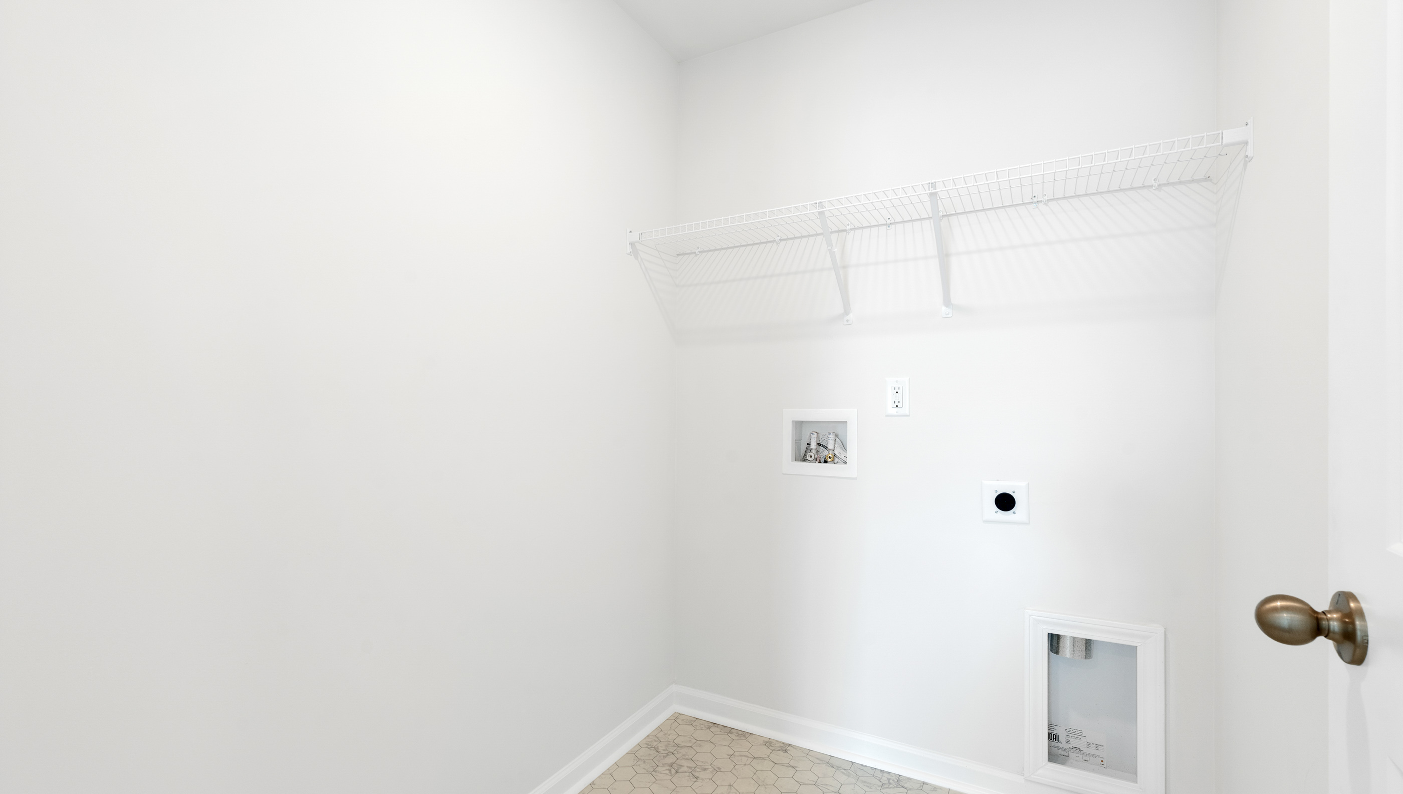 Laundry room with hanging stroage racks.