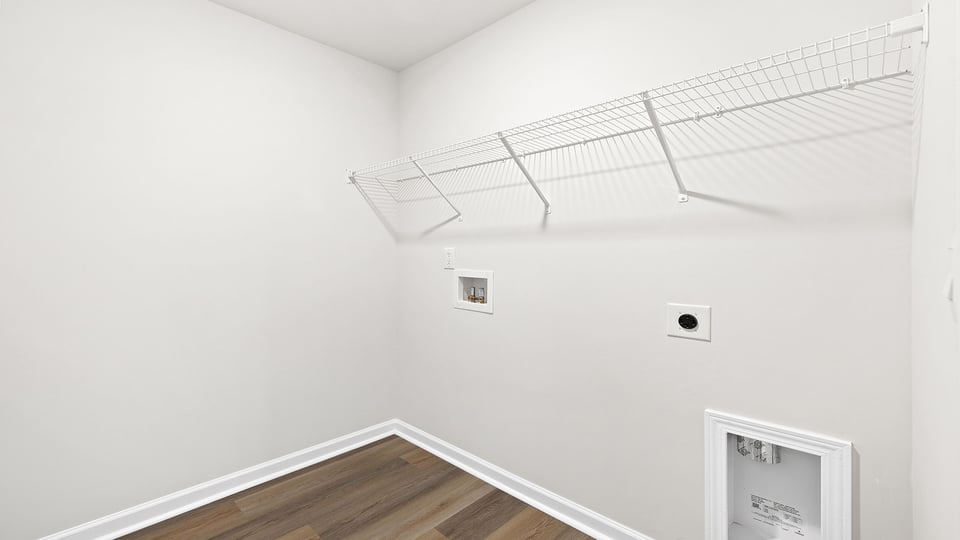 Laundry room with shelving.