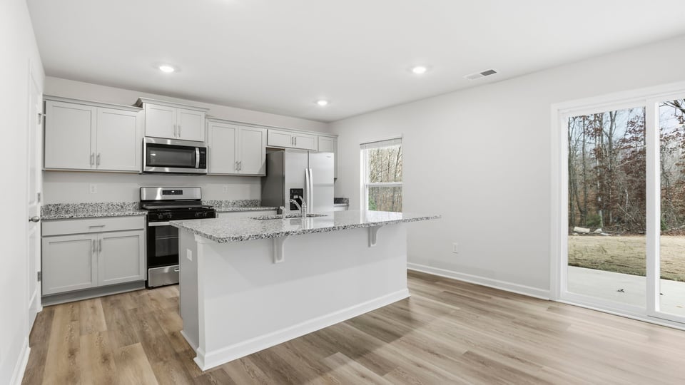 View of kitchen and door to the back yard.