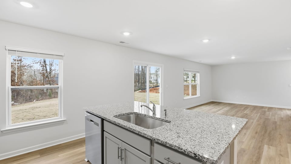 View from kitchen of combination dining and living areas.