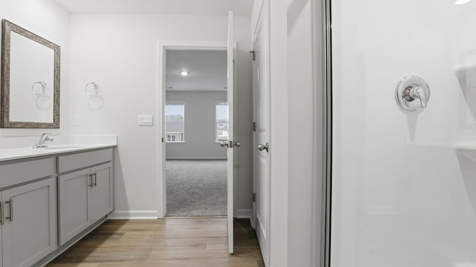 Hall bathroom with dual sink vanity.