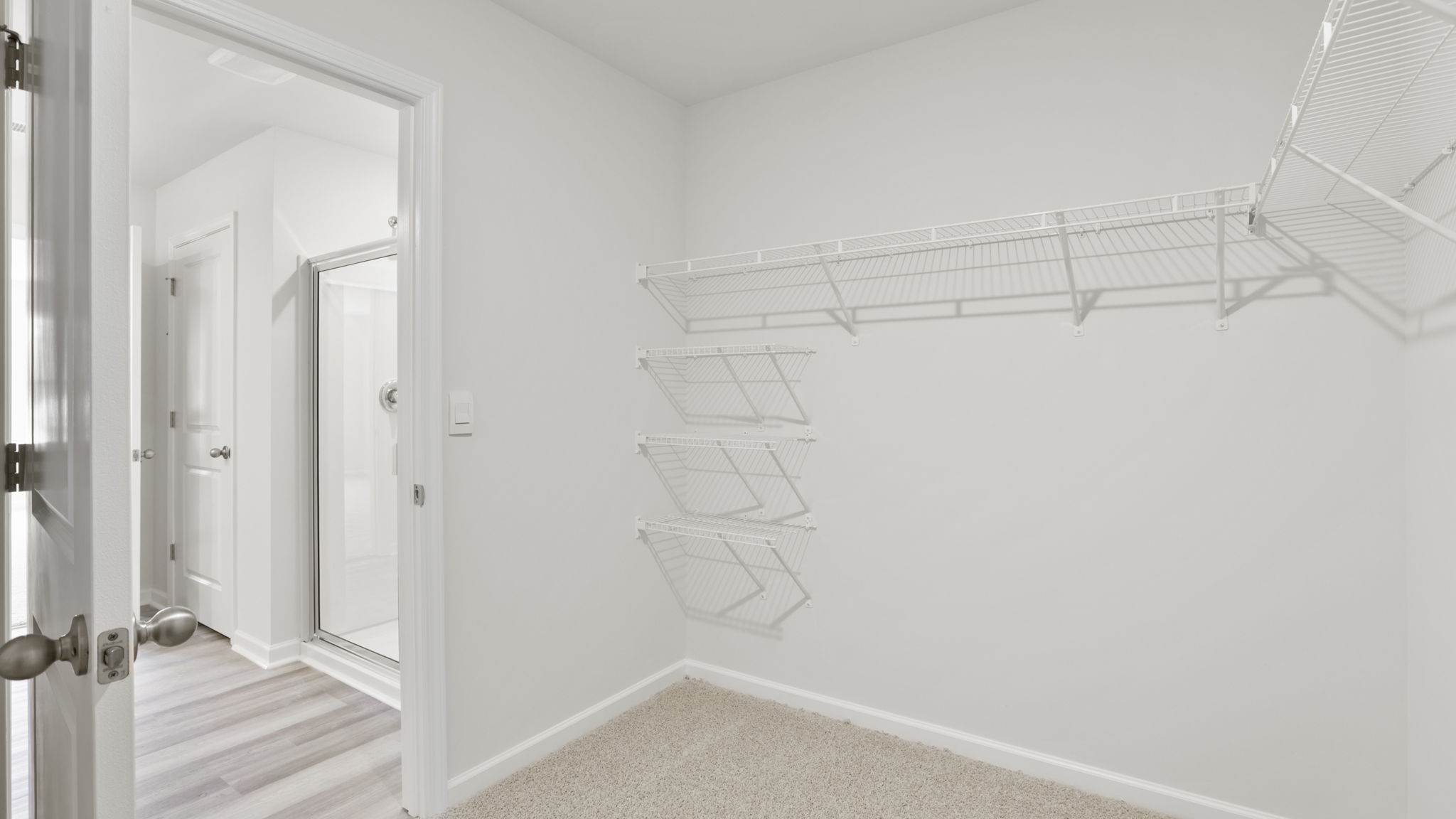 Closet with hanging storage racks.