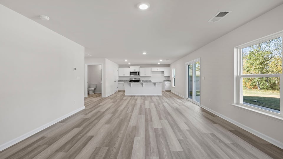 View of combination living and dining areas.