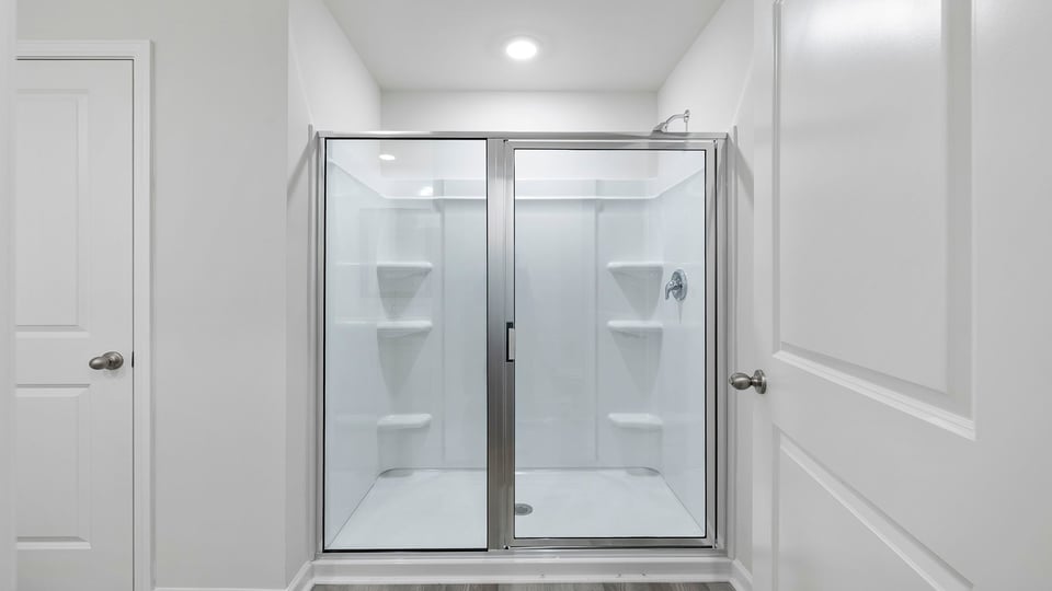 Primary bathroom walk-in shower.