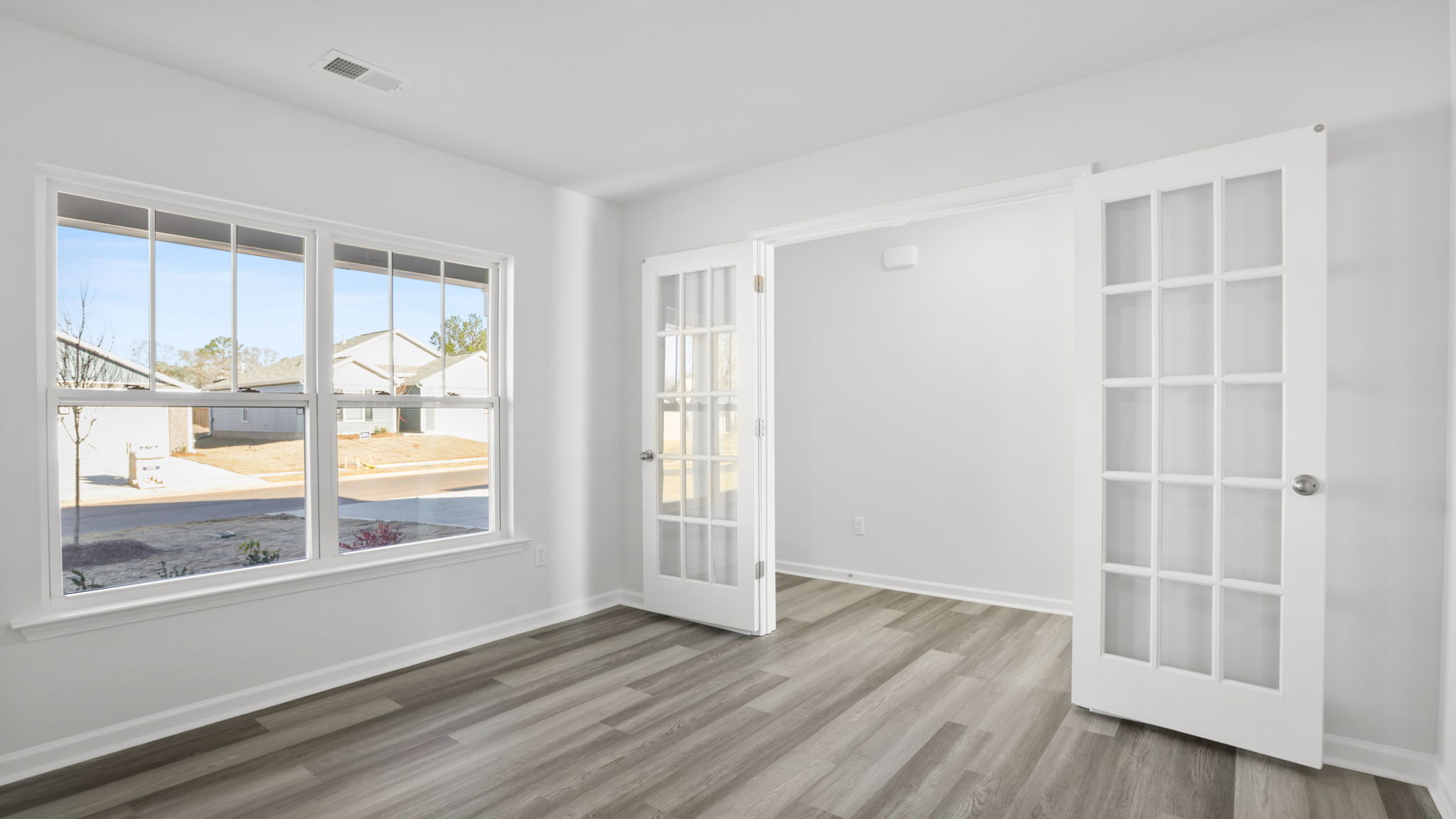 Study accented by French doors.