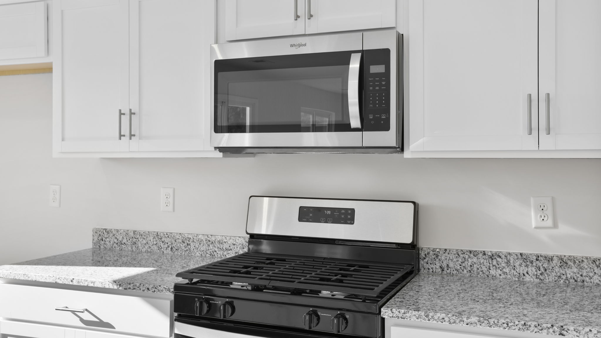 Kitchen with stainless steel appliances and walk in pantry.