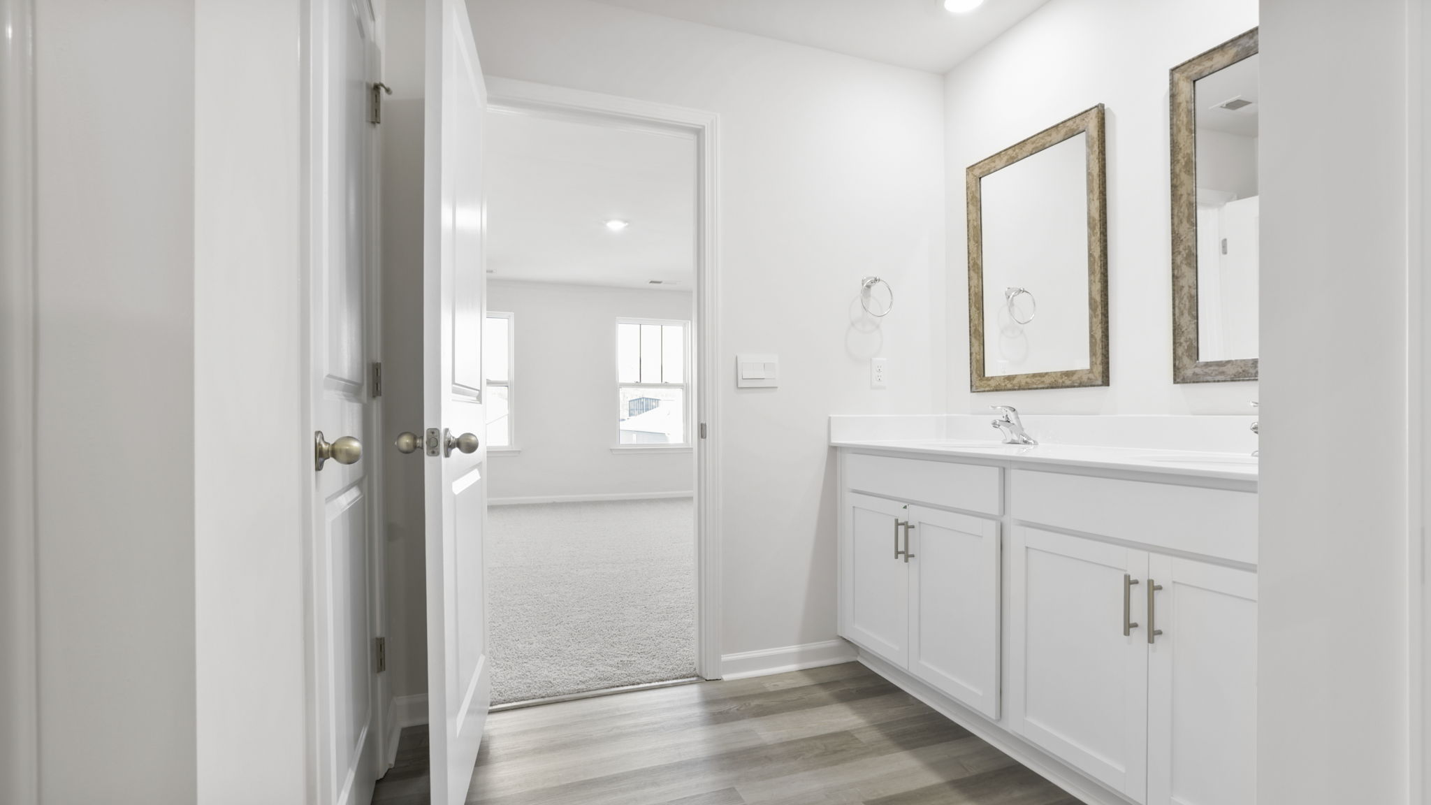 Primary bathroom with double sink vanity.