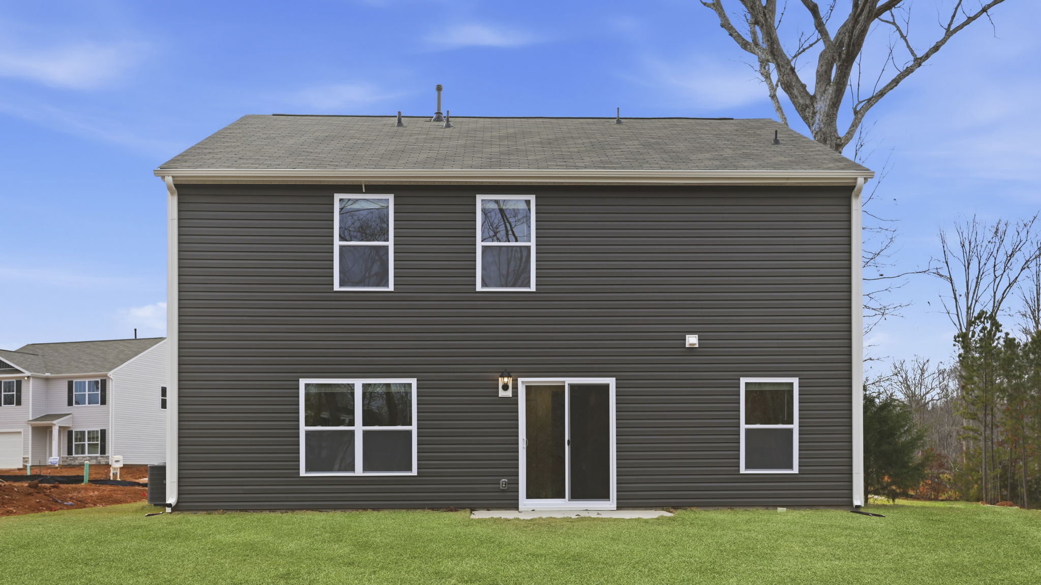 Back exterior of Penwell with large backyard.