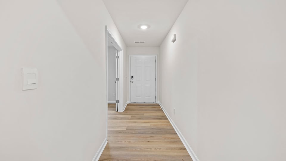 Hallway view toward the foyer.