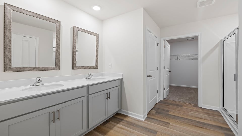 Primary bathroom with dual sink vanity.