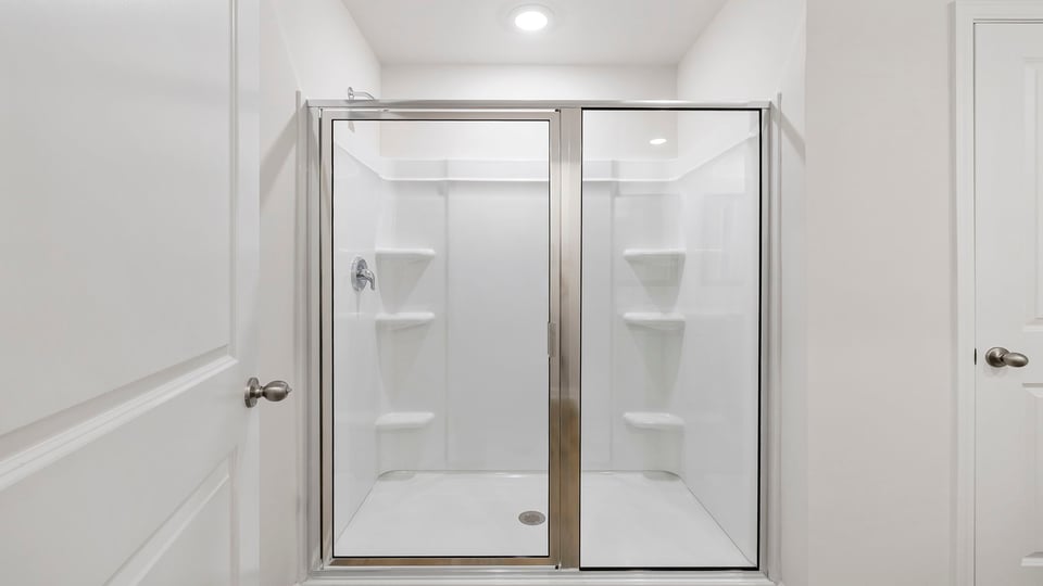 Primary bathroom with walk-in shower.