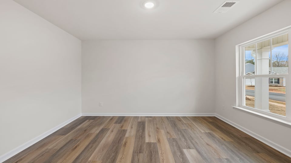 Study located at front of home with window.