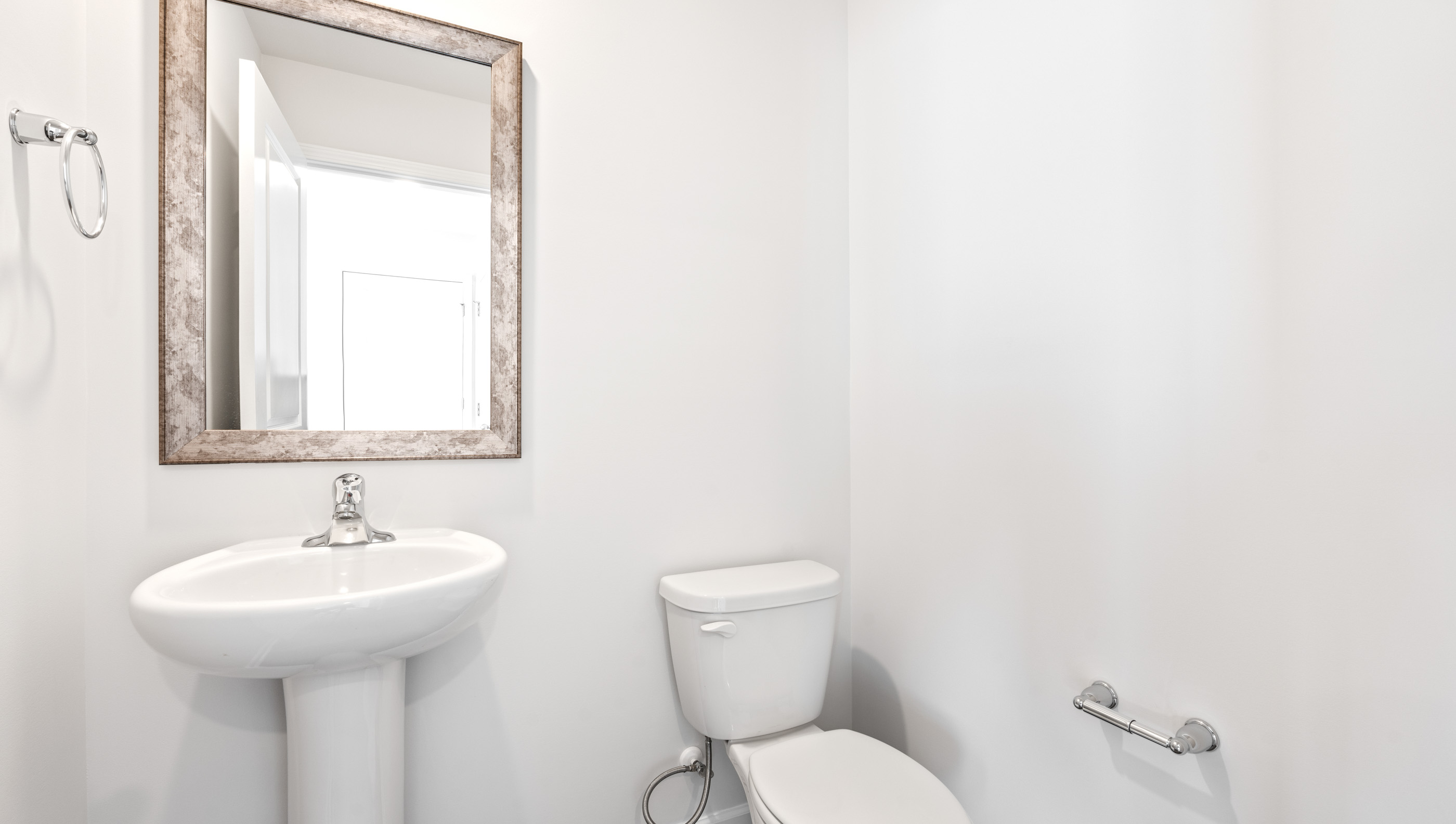 Bathroom with toilet and sink.