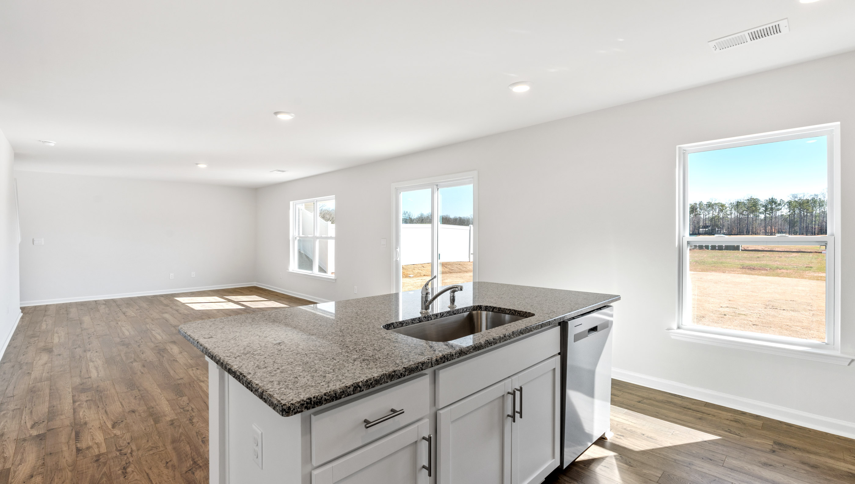 Kitchen and island with granite tops.