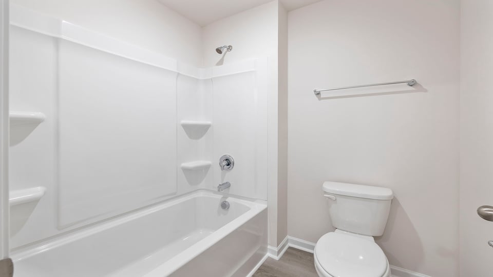 Hall bathroom with combination shower / tub.