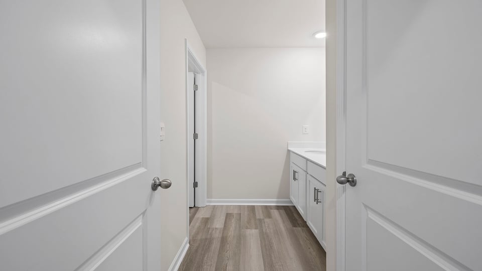 Hall bathroom with dual sink vanity.