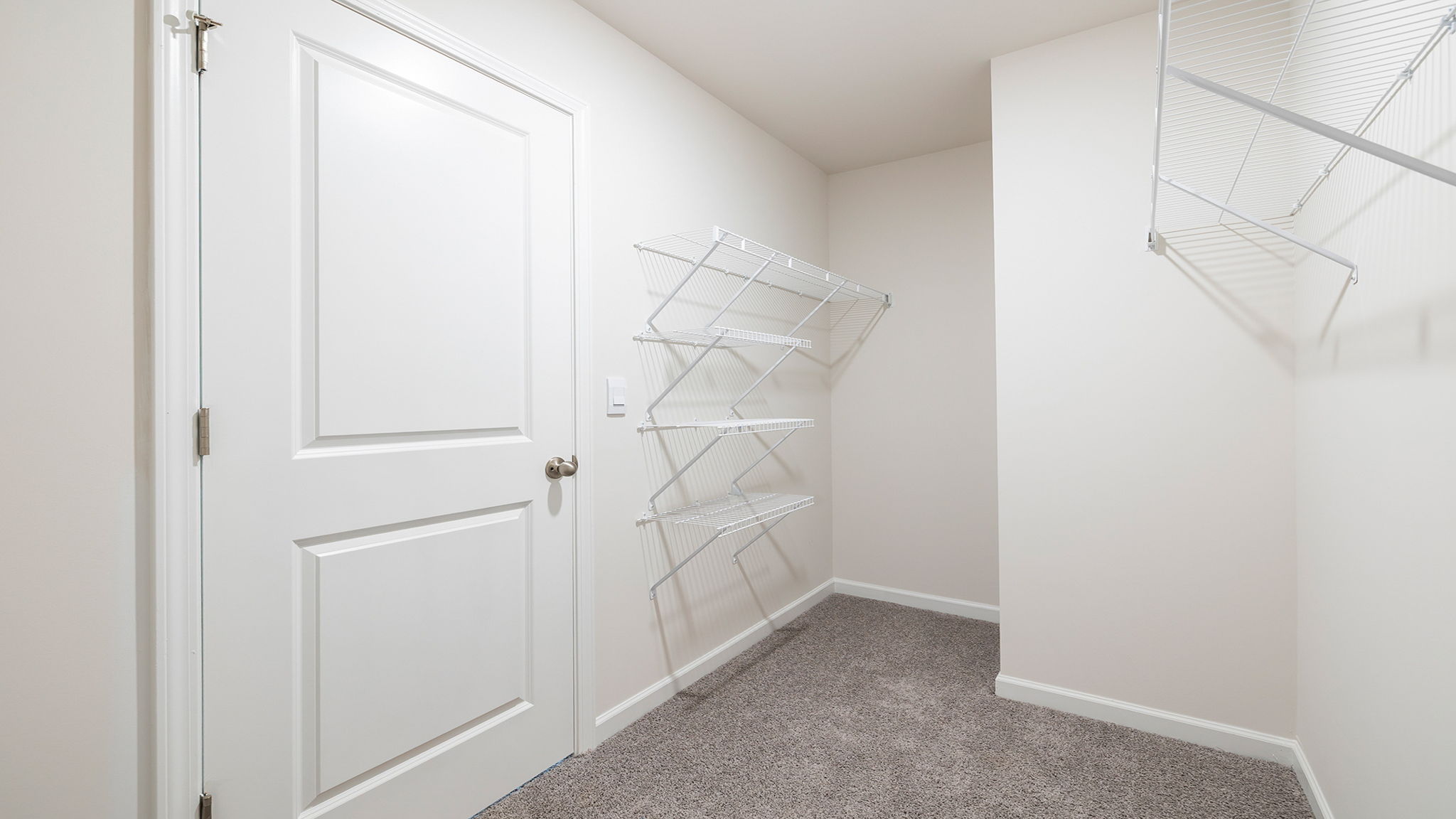 Primary bedroom walk-in closet.