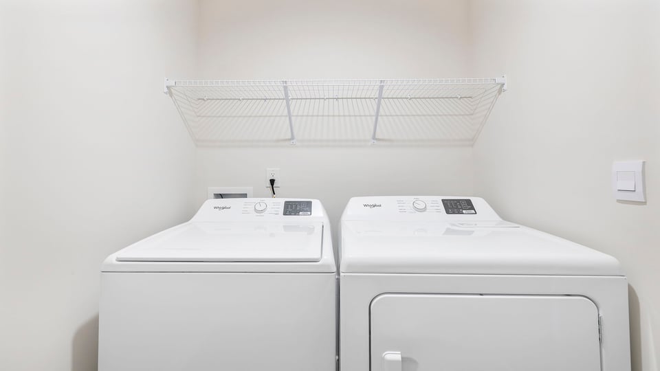 Laundry room with shelving.
