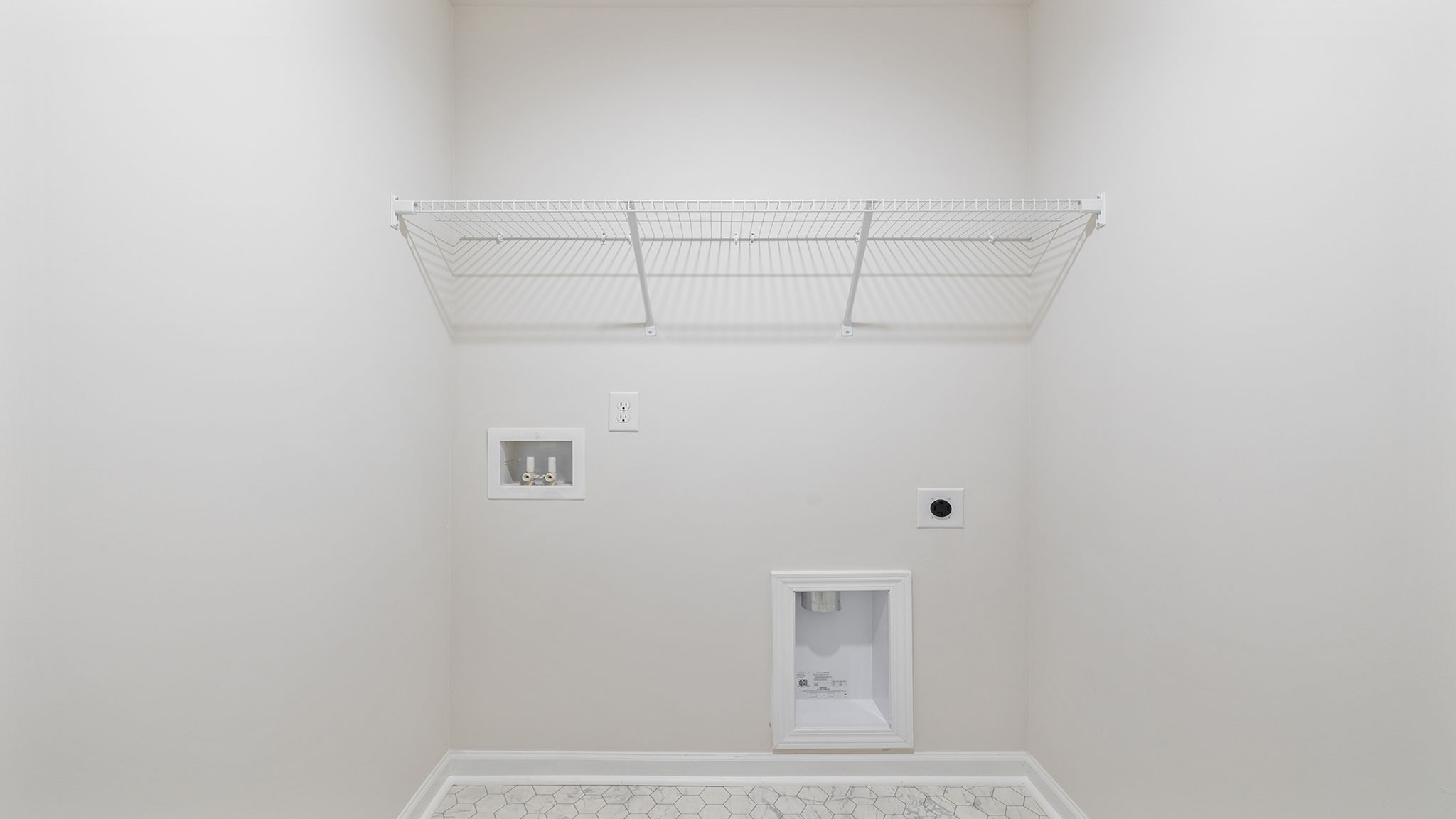 Laundry room with shelving.