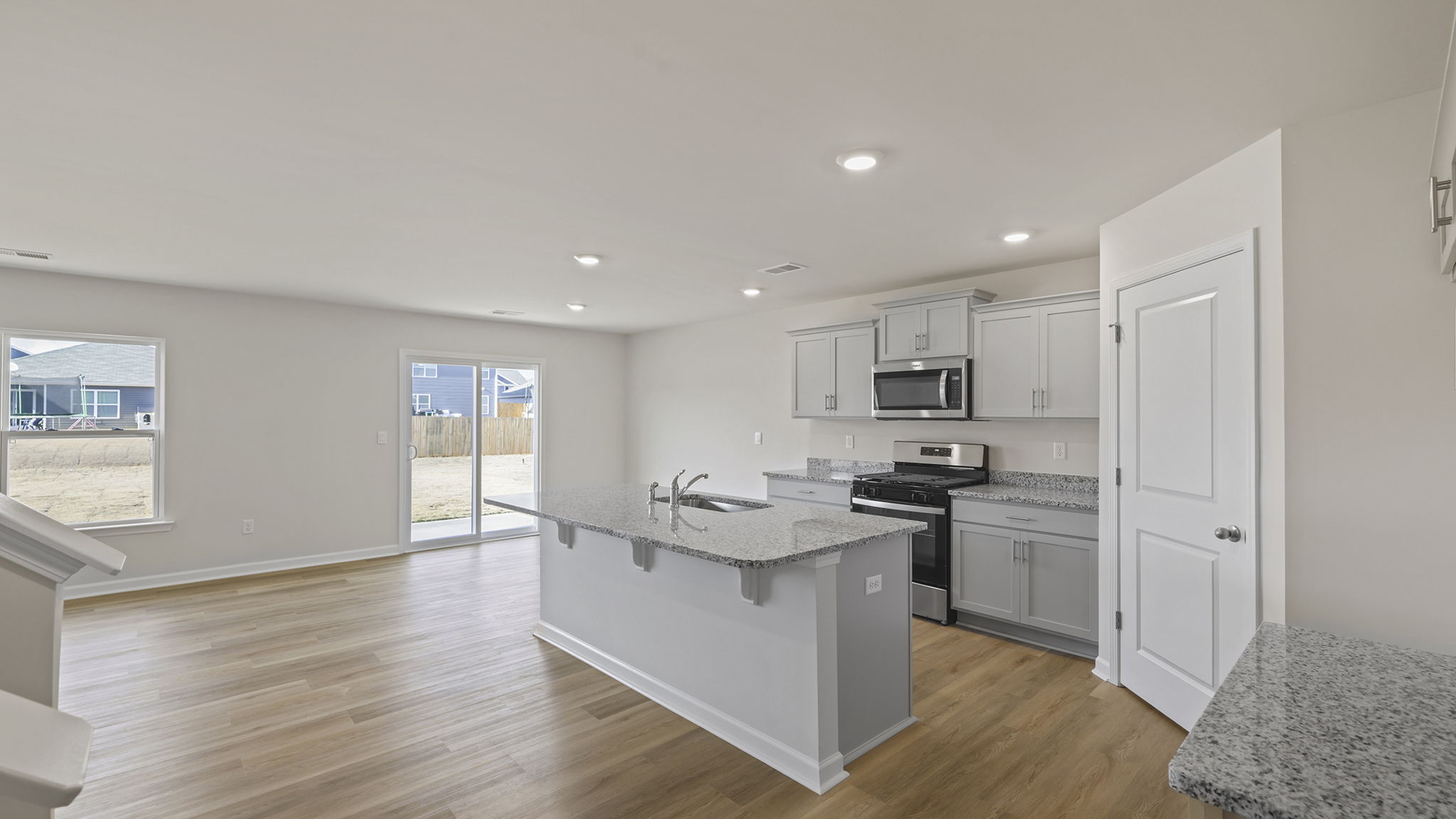 View of open floor plan with lots of windows.