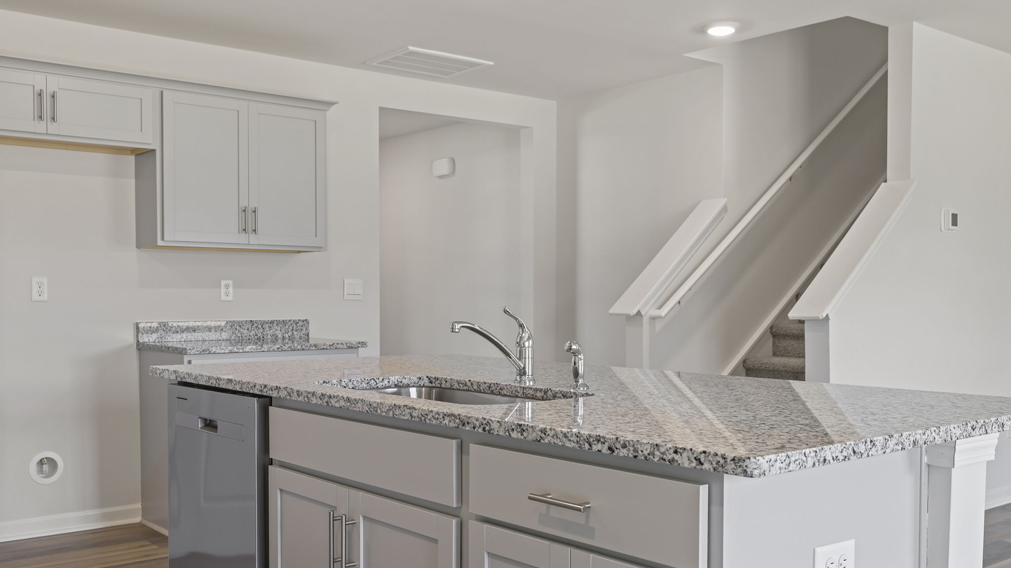 Kitchen island and view of staircase.