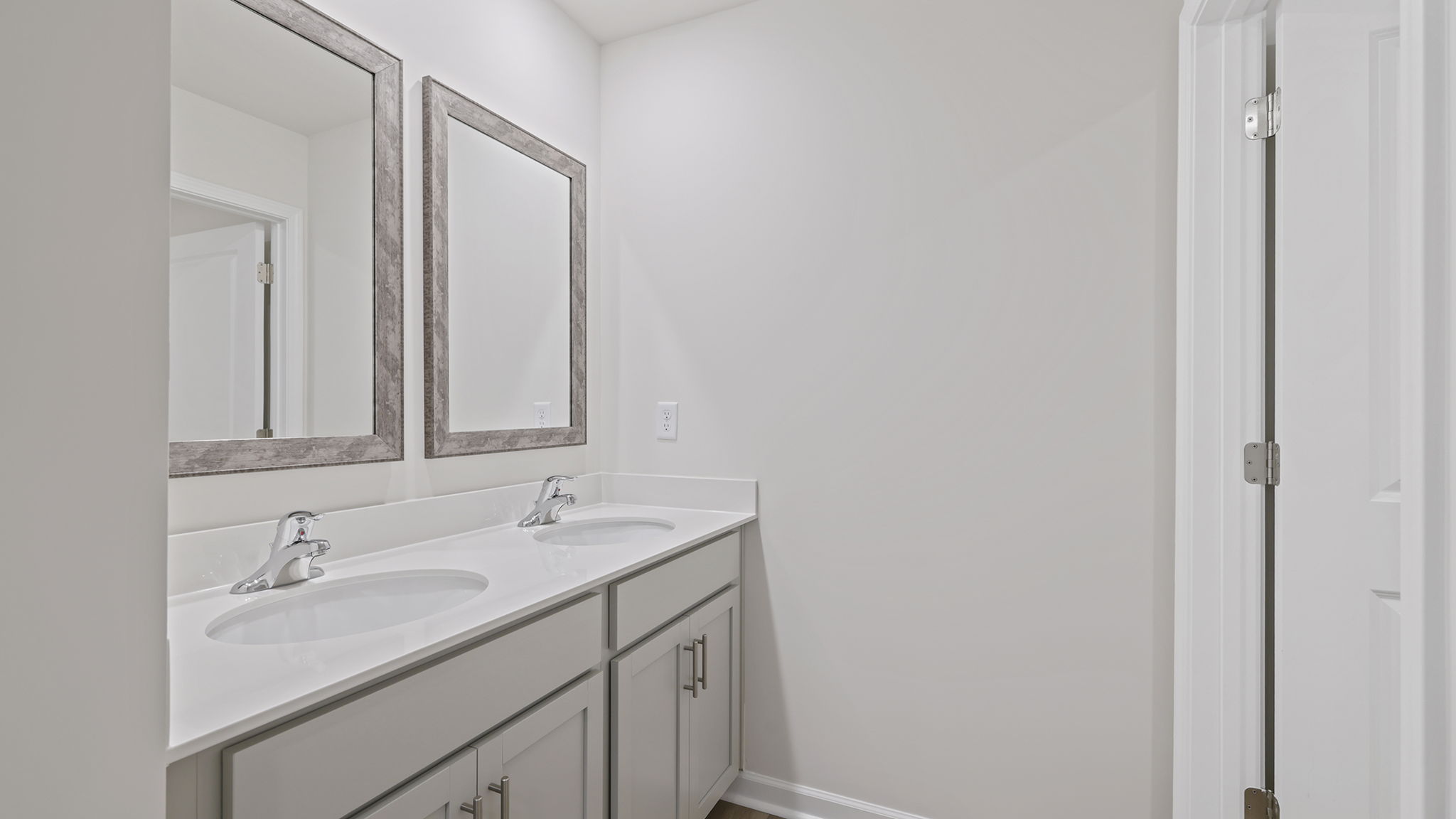 Hall bathroom with dual sink vanity.