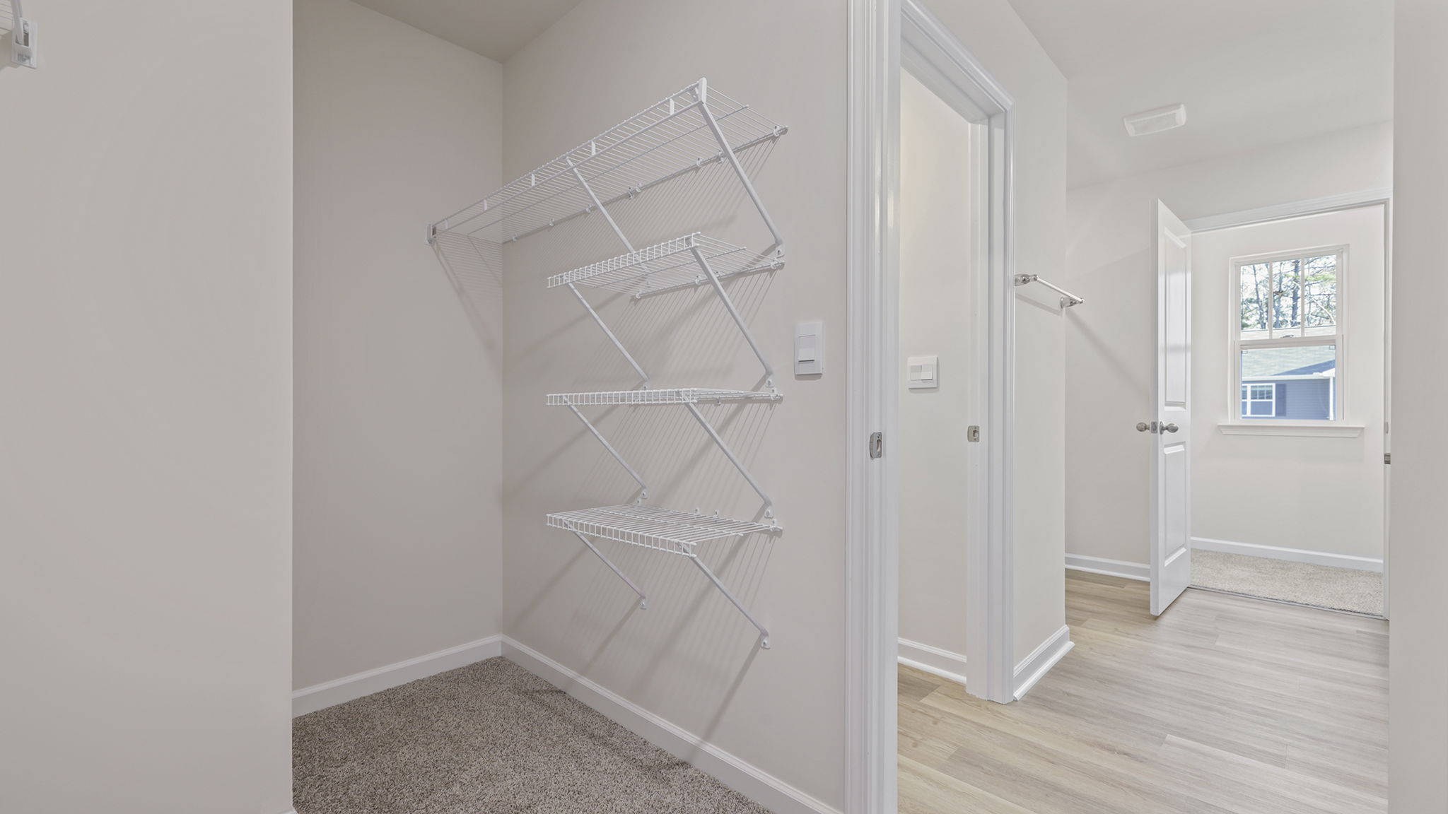 Primary bedroom walk-in closet.