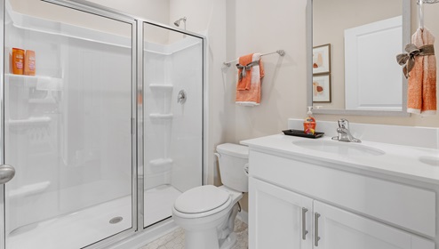 Bathroom with vanity sink and shower.