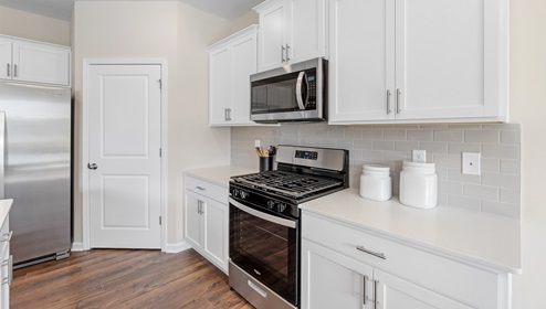 Kitchen with cabinets and appliances.