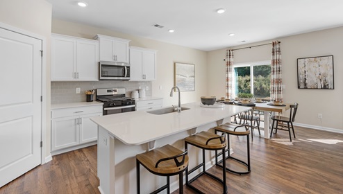 Kitchen with island and cabinets.
