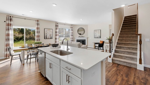 Kitchen with island and cabinets.