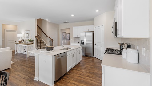 Kitchen with island and cabinets.